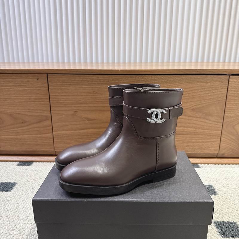 Chanel CC logo buckle ankle boots in dark brown calfskin leather displayed on black box